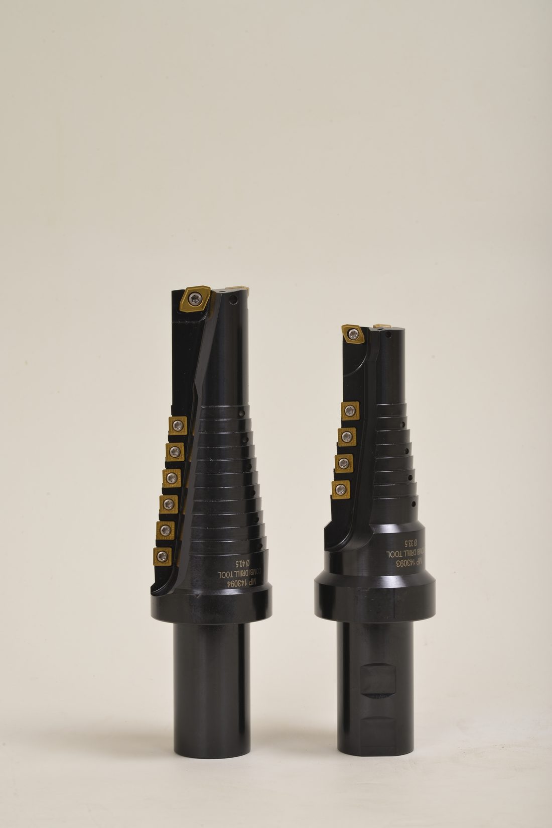 Two stepped tool holders, paired