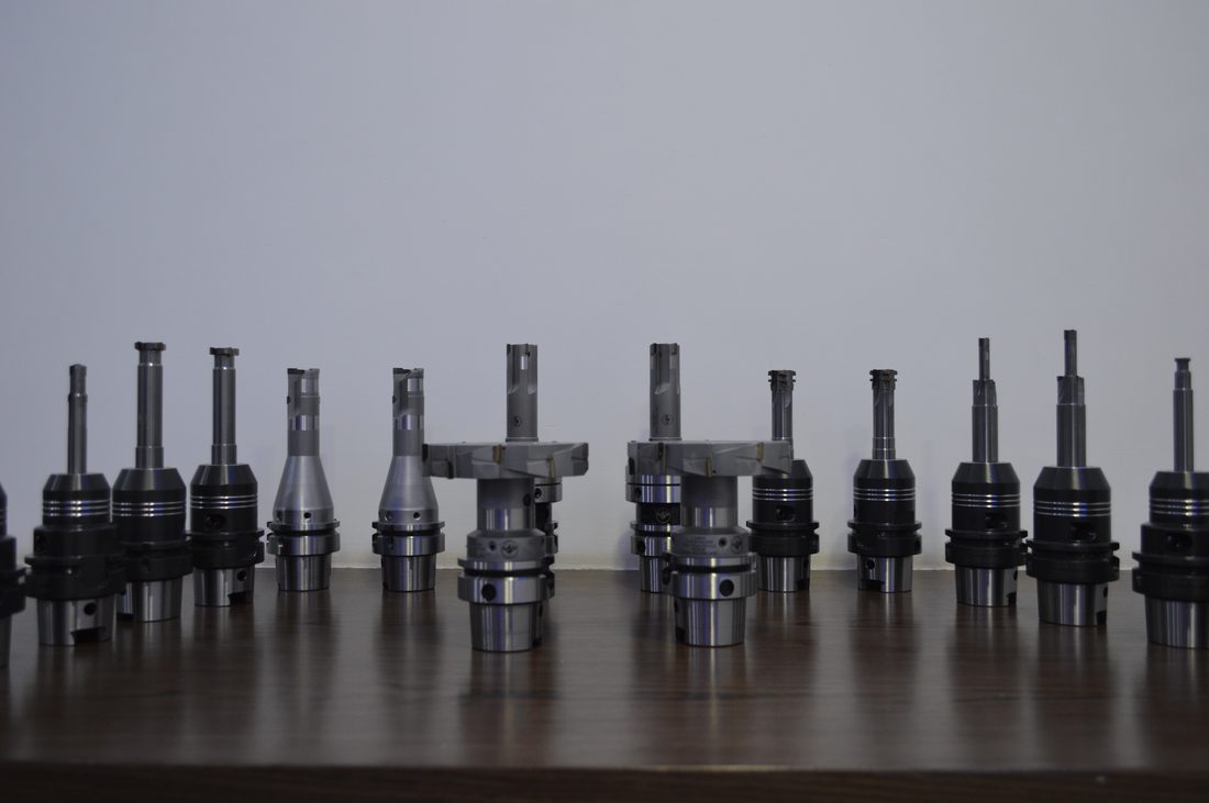 Row of tool holders and cutters