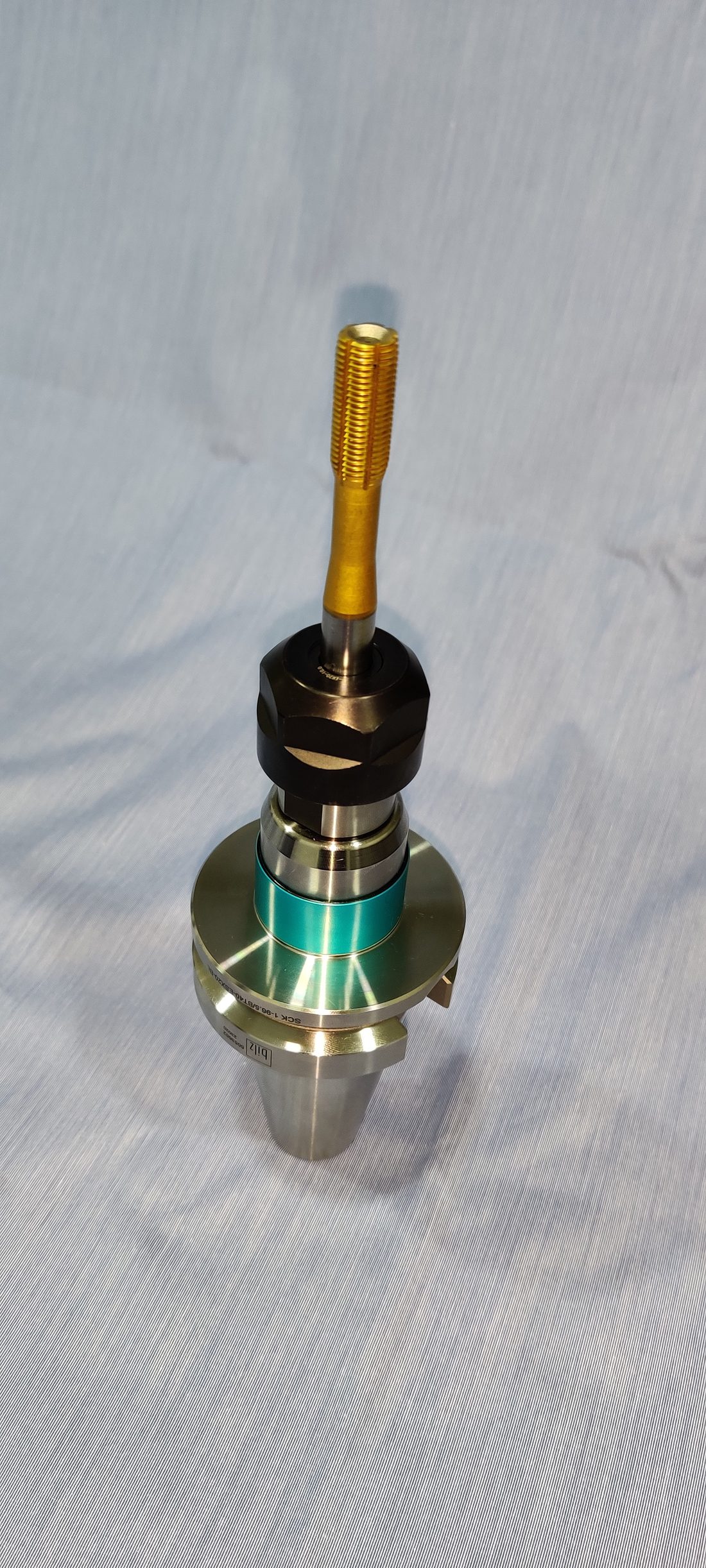Tool holder with a distinctive coated finish