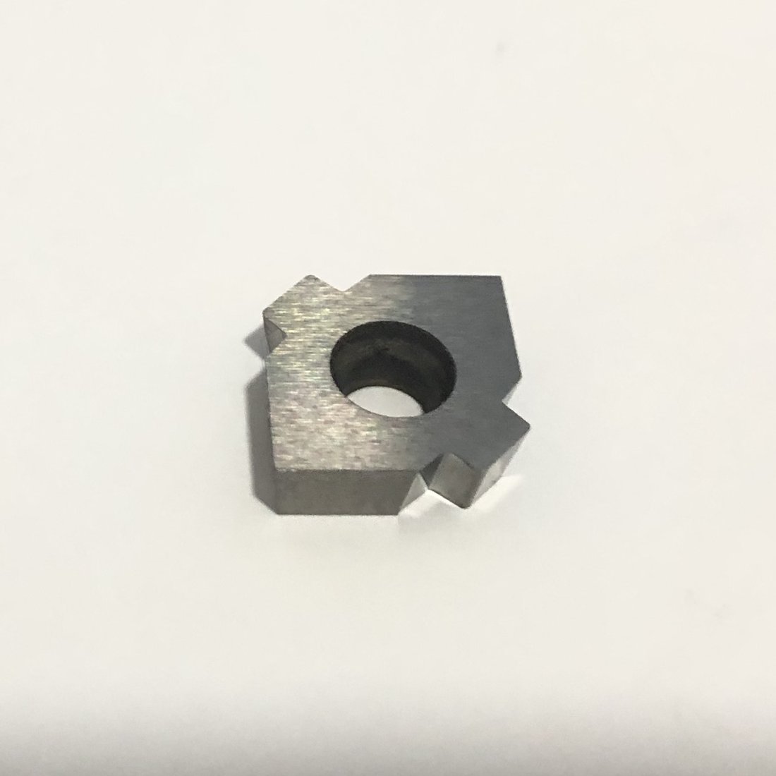 Square insert with a center mounting hole