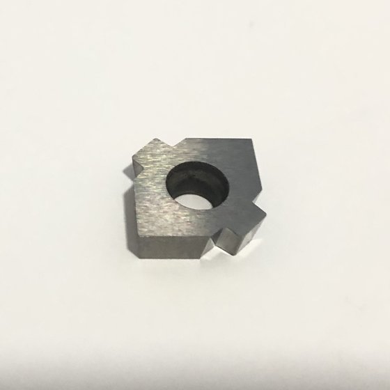 Square insert with a center mounting hole